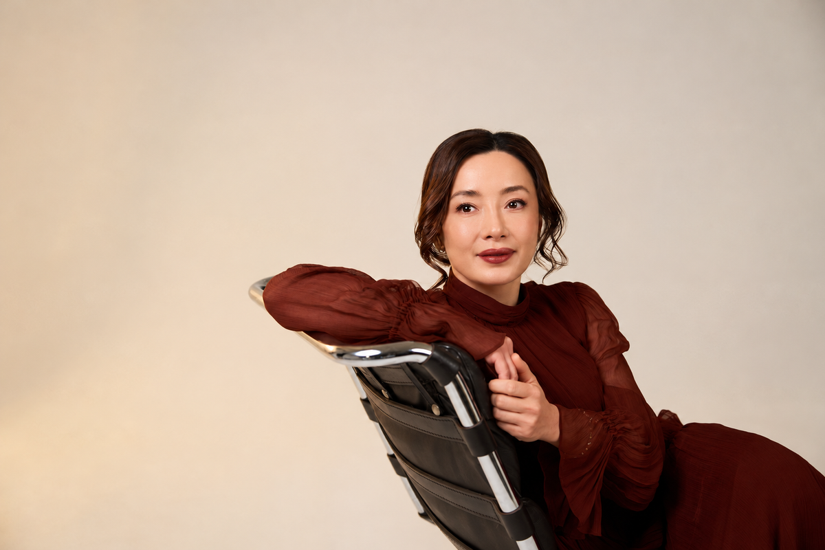 Lyn Shan, founder of SR LUXE, in a burgundy dress