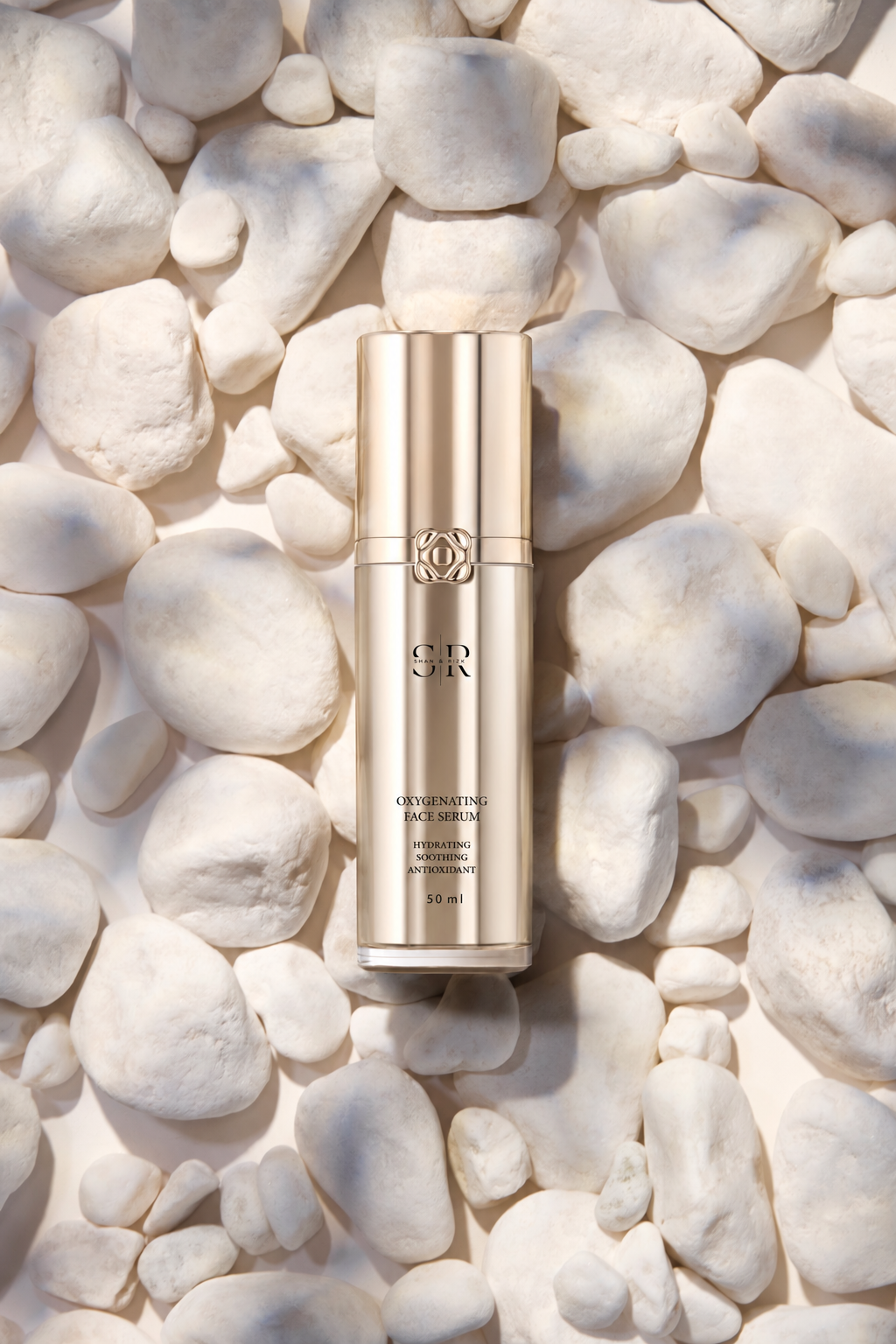 SR LUXE serum on white stones with softened gold reflections